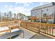 Spacious outdoor deck with a wooden railing offering views of the surrounding neighborhood at 1203 Corkery Ridge Ct, Cary, NC 27519