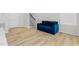 The living room features hardwood floors and a blue velvet couch at 1203 Corkery Ridge Ct, Cary, NC 27519