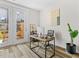 Bright home office with wood floors, a modern desk, outdoor views from patio, and comfortable workspace at 1203 Corkery Ridge Ct, Cary, NC 27519