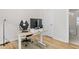 Clean, well-lit office space with a modern desk, ergonomic chair, and wood flooring at 1203 Corkery Ridge Ct, Cary, NC 27519