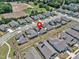 Aerial view of a neighborhood featuring well-maintained lawns and sidewalks at 1217 Linkwood Way, Fuquay Varina, NC 27526