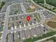 This aerial view of the neighborhood highlights the location near a small pond at 1217 Linkwood Way, Fuquay Varina, NC 27526