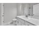 Bathroom with white vanity, framed mirror, and white cabinets at 1217 Linkwood Way, Fuquay Varina, NC 27526