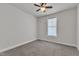 Neutral bedroom featuring a ceiling fan and bright natural light at 1217 Linkwood Way, Fuquay Varina, NC 27526