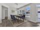 Staged dining room featuring hardwood floors, a dining table with chairs, an elegant chandelier and backyard access at 1217 Linkwood Way, Fuquay Varina, NC 27526
