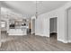 Open concept kitchen and dining area with hardwood floors, lots of cabinets and counter space and an airy feel at 1217 Linkwood Way, Fuquay Varina, NC 27526