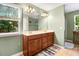 Bathroom featuring a double vanity, window, and neutral-toned walls at 1304 Double Oak Ln, Willow Springs, NC 27592