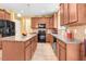 Functional kitchen with granite countertops, modern appliances, and an efficient layout at 1304 Double Oak Ln, Willow Springs, NC 27592