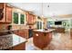 Open-concept kitchen flows into the living room with granite counters and modern amenities at 1304 Double Oak Ln, Willow Springs, NC 27592