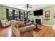 Bright living room with a fireplace, plush seating, and large windows at 1304 Double Oak Ln, Willow Springs, NC 27592