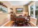 A cozy sitting room with a poker table, a large window, and classic decor at 1304 Double Oak Ln, Willow Springs, NC 27592
