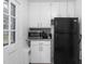 Cozy kitchen featuring white cabinets, stainless steel appliances, and plenty of natural light at 1400 Roslyn Dr # 17B, Burlington, NC 27215