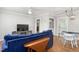 Comfortable living room with hardwood floors and stylish blue sofa at 1400 Roslyn Dr # 17B, Burlington, NC 27215