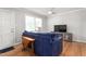 Cozy living area with hardwood floors, natural light, and a comfortable sofa at 1400 Roslyn Dr # 17B, Burlington, NC 27215
