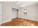 Cozy bedroom with closet space and hardwood floors offering charm and practicality at 1411 Hudson Ave, Durham, NC 27705