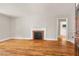 Spacious living room features a decorative fireplace and hardwood floors at 1411 Hudson Ave, Durham, NC 27705