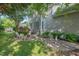 Backyard featuring a well-maintained lawn, lush landscaping, and patio with outdoor seating at 1504 Haventree Rd, Durham, NC 27713