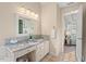 Bathroom vanity with granite counters, tile floors, and vanity lighting at 1504 Haventree Rd, Durham, NC 27713