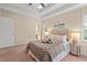 Bright Primary bedroom with a trey ceiling, plush carpet, and natural light at 1504 Haventree Rd, Durham, NC 27713