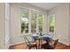 Cozy breakfast nook with bright windows and seating for four at 1504 Haventree Rd, Durham, NC 27713