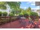 Exterior view of a wooden deck with outdoor seating and views of the yard at 1504 Haventree Rd, Durham, NC 27713