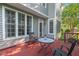 Exterior view of a wooden deck with outdoor seating and views of the yard at 1504 Haventree Rd, Durham, NC 27713