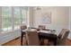 Bright dining room features a wood table, upholstered chairs, and natural light at 1504 Haventree Rd, Durham, NC 27713