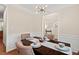 Well-lit dining room with modern chandelier, wood table, and comfortable seating at 1504 Haventree Rd, Durham, NC 27713