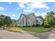 Charming two-story home with gray siding, green shutters, and a beautifully landscaped front yard on a corner lot at 1504 Haventree Rd, Durham, NC 27713