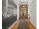 Hallway featuring original hardwood floors and stylish decor for the historic Caraleigh Mills at 1535 Caraleigh Mills Ct # 210, Raleigh, NC 27603