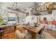 Spacious living room with a built-in bookshelf, wood floors, and an open floor plan at 1535 Caraleigh Mills Ct # 210, Raleigh, NC 27603