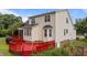 Spacious red back deck connects to the home's exterior with convenient stairs and attractive design at 1604 Carnation Dr, Durham, NC 27703