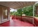 Inviting back deck with painted wood and overlooking a private backyard with mature trees at 1604 Carnation Dr, Durham, NC 27703