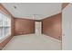 Comfortable bedroom with neutral carpet and walls, white trim, and lots of natural light at 1604 Carnation Dr, Durham, NC 27703