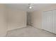 Bedroom with neutral walls, plush carpeting, and natural light at 1604 Carnation Dr, Durham, NC 27703