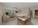 Spacious bonus room with natural light, a foosball table, and neutral decor at 1604 Carnation Dr, Durham, NC 27703