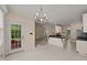 Dining area that overlooks living room and kitchen, creating an open space for entertaining at 1604 Carnation Dr, Durham, NC 27703