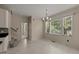 Bright dining area featuring natural light and views, with adjacent stairs at 1604 Carnation Dr, Durham, NC 27703