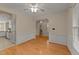 Bright dining room with wood floors, white wainscoting, and an abundance of natural light. Ready for your furnishings! at 1604 Carnation Dr, Durham, NC 27703