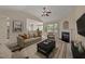 Inviting living room with vaulted ceilings, fireplace, and view into dining area at 1604 Carnation Dr, Durham, NC 27703