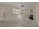 Bright living room featuring neutral tones, large windows and a fireplace at 1604 Carnation Dr, Durham, NC 27703