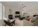 Cozy living room features a fireplace, ample seating, and natural light at 1604 Carnation Dr, Durham, NC 27703