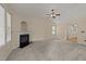 Spacious living room showcasing fireplace and neutral paint, filled with natural light at 1604 Carnation Dr, Durham, NC 27703