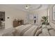 Well-decorated main bedroom with neutral colors, tray ceiling, ceiling fan, and plenty of space to relax at 1604 Carnation Dr, Durham, NC 27703