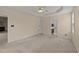 Large main bedroom features tray ceiling, neutral carpet and an attached bathroom at 1604 Carnation Dr, Durham, NC 27703