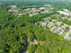 Expansive aerial view of a community surrounded by lush greenery and convenient access to nearby commercial areas at 1605 Valley Run, Durham, NC 27707