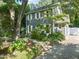 Front exterior with lush garden, showcasing the charming two-story home at 1605 Valley Run, Durham, NC 27707