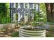 Inviting home exterior featuring garden beds and climbing trellises flanking the entrance at 1605 Valley Run, Durham, NC 27707