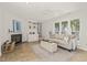 Comfortable living room features a fireplace, built-in shelves, and windows offering abundant natural light at 1605 Valley Run, Durham, NC 27707