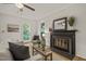 Inviting living room features a fireplace, hardwood floors, and ample natural light at 1605 Valley Run, Durham, NC 27707